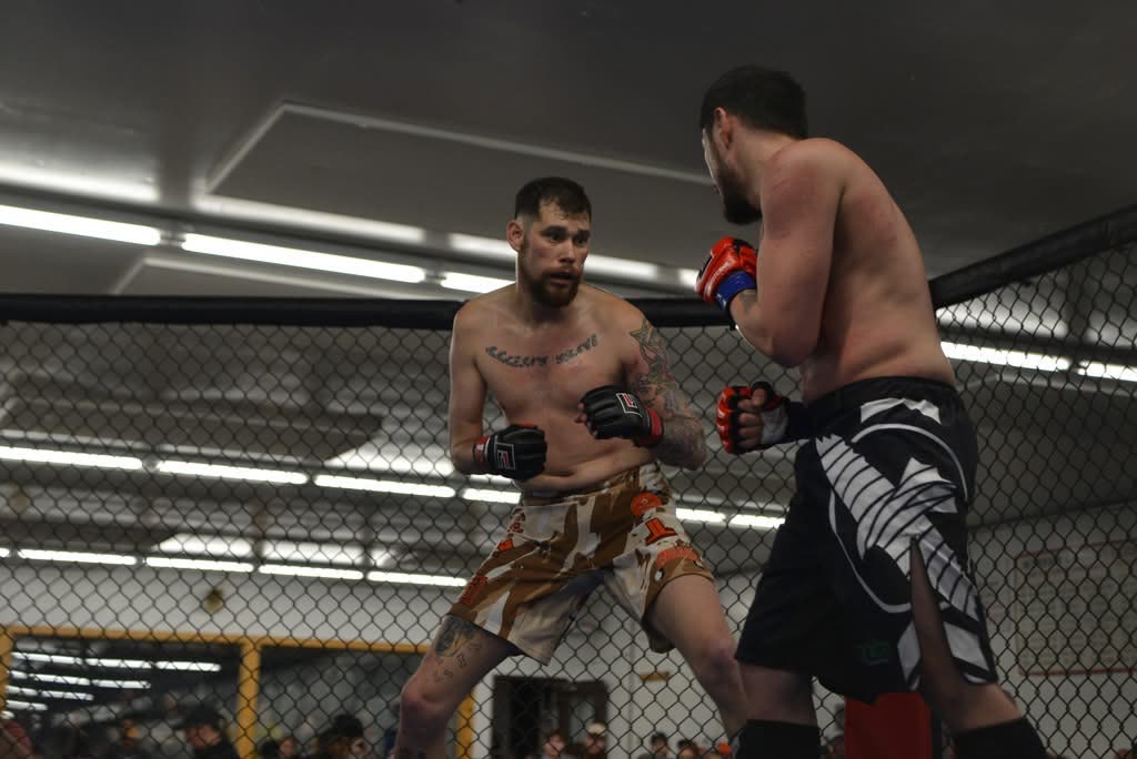 Cody Galloway in MMA competition stance inside the cage